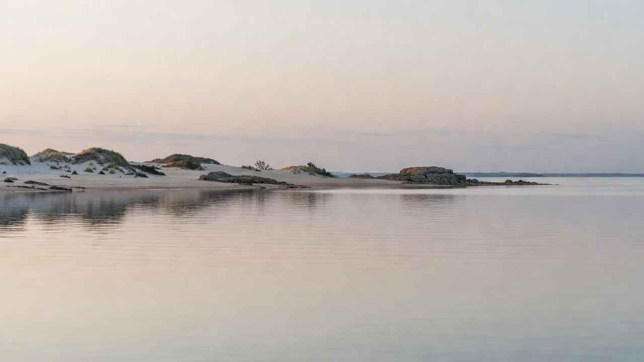 Calm bay and low coastline in soft light